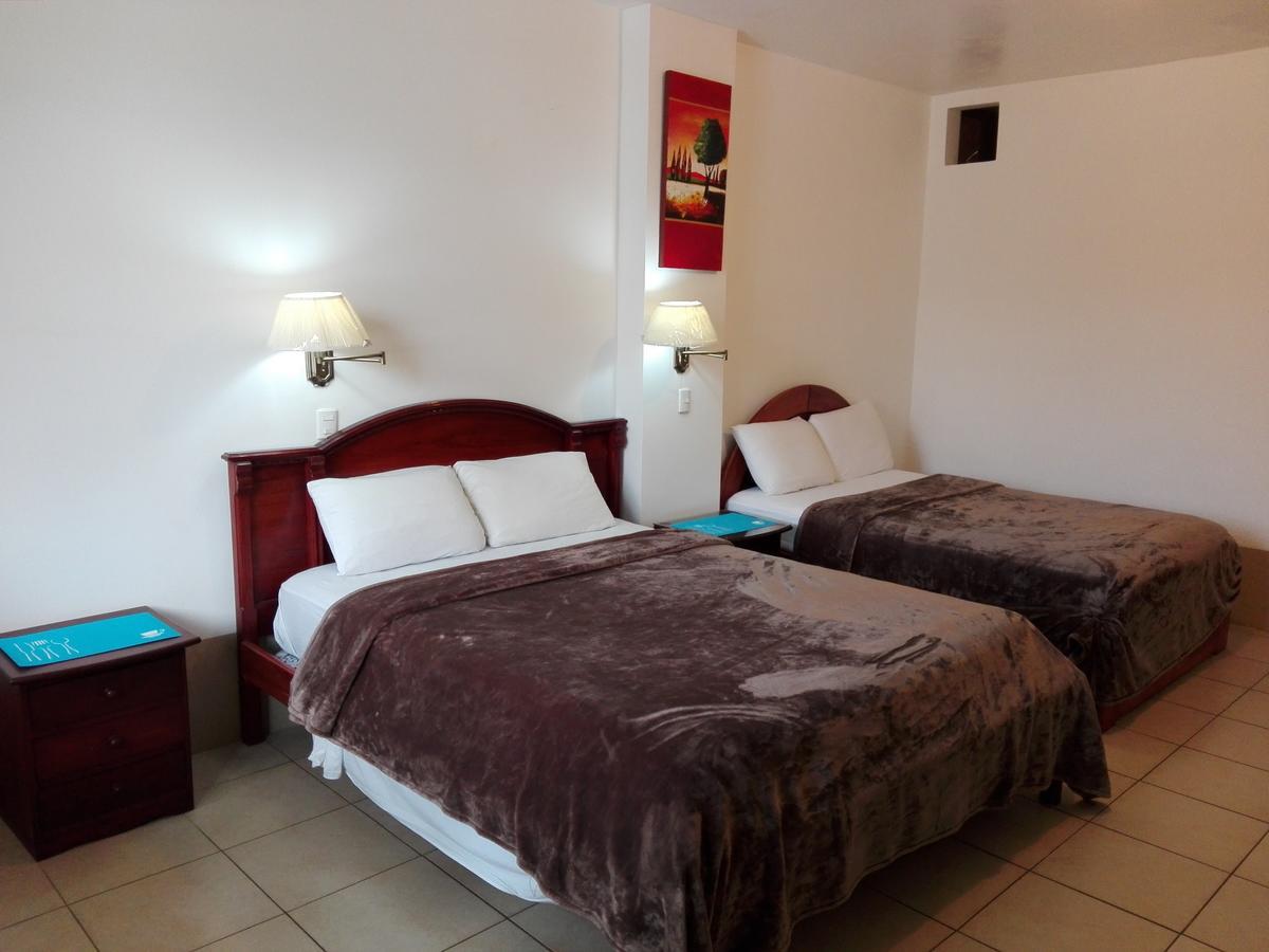 Hotel Pacifico ปูแอร์โตโลเปซ ภายนอก รูปภาพ